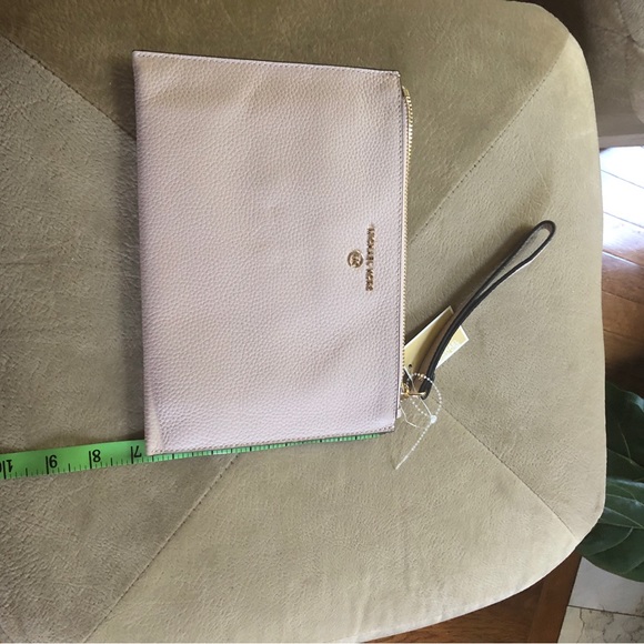 Michael kors large light pink wristlet with gold hardware. - Picture 7 of 10